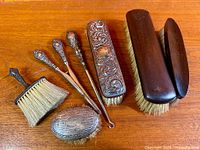 Group shot of all seven dresser pieces displayed on wood surface
