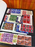 Album page displaying assorted mint GB corner blocks with selvedge