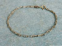Full view of anchor link bracelet laid flat