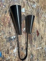 Full view of agogo bell showing both bells and handle