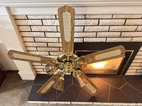 Top view of assembled brass ceiling fan on hearth