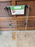 Bag Buddy frame standing folded with label visible