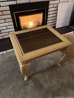 Angled view of entire table showing glass top and legs