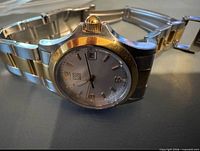 Wristwatch angled view showing dial, bezel and bracelet links