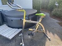 Left side profile of Hydrorider Aquabike showing frame, branding, seat, handlebars and base