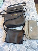 Four purses laid out showing overall styles and colors