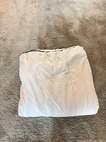 Folded white duvet showing top surface