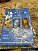 Front cover sealed in plastic showing title, images, free audio CD sticker