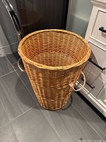 full view of wicker laundry hamper beside appliances