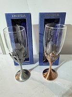 Front view of both wine glasses and boxes
