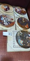 Four Knowles Norman Rockwell plates in boxes