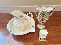 Pitcher, basin, urn/vase and match box grouped together