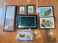 Group shot showing all five framed artworks, album, stained glass