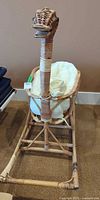Full view of wicker goose cradle on rocking base