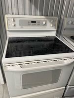 Front view of Kenmore white electric range