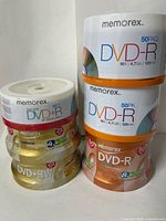 All six Memorex DVD spindles stacked, labels visible for type and pack size.