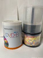 Memorex DVD-R 100-pack spindle, Burn Rite CD-R spindle, partial spindle stacked