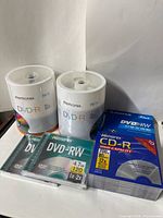 Front view showing both Memorex DVD-R spindles, two Memorex DVD-RW singles, Fujifilm DVD-RW 5-pack, and Memorex CD-R 10-pack