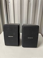 Front view showing both Sony speakers with grilles and logos