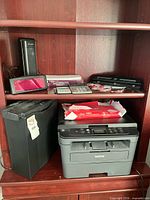 Overall view showing printer, shredder, lamp, calculators, document device and paper