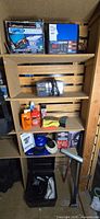 Overview of shelving with chargers, polisher, towels and bottles