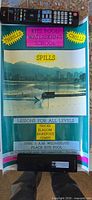 Unframed Kits Pool Waterskiing School promotional poster displayed on floor