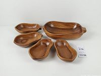 Five wood bowls laid out, showing sizes and shape