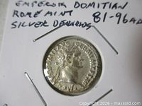 Obverse of Domitian silver denarius in coin flip