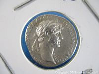 Obverse of Hadrian silver denarius in flip