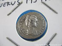 Obverse side of Julia Domna silver denarius within cardboard flip