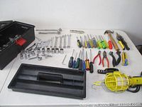 Overview of toolbox and all hand tools laid out on table