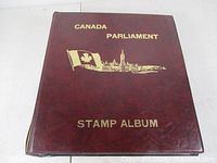 Maroon binder cover titled Canada Parliament Stamp Album