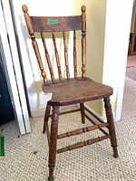 Front view of antique wood spindle-back chair