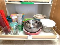 Overall contents of lot in cabinet pull-out