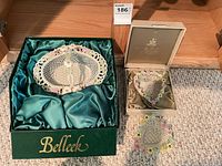 Overall lot showing both Belleek bowls and their presentation boxes