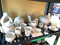Group shot of all Belleek pieces on shelf