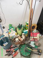 Wide view of lot showing hose reel, tools, chemicals, ornaments