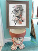 Painting and planter together for scale and context