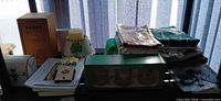 Shelf view showing Paddy crate, mug set box, shamrock hat, linens and accessories
