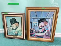 Both framed Red Skelton prints side by side