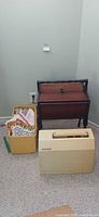 Singer sewing machine case, wooden organizer box, yellow tote of fabric
