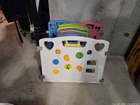 Front view of white activity panel and stacked colored panels