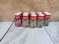 Front view of all 10 toothpaste bottles showing flavors