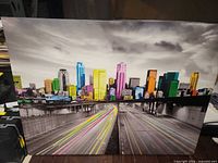 front view of full canvas showing city skyline and highway
