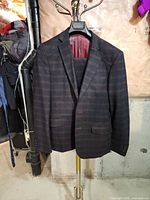 Front view of jacket on hanger showing pattern and color