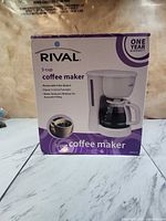Front of Rival 5-cup coffee maker retail box