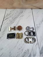 All seven buckles laid out