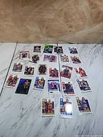Full layout of approximately twenty-four Panini Chronicles WWE trading cards