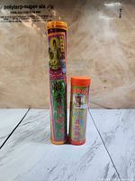 Tall and short Zhicheng incense canisters standing upright, full labels visible