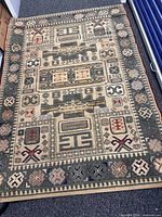 Top view of full rectangular rug showing design and condition